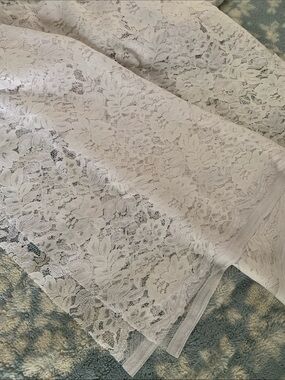 White lace material 
Unused
Approximate measurements: 56” x 2 yards